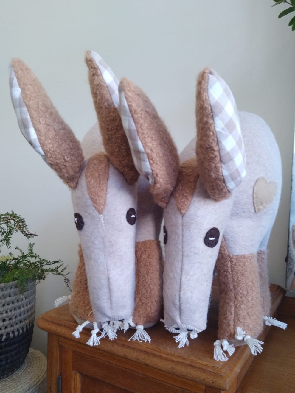 Aardvark soft toy with various textures of fabrics, large checked ears, a long snout ad a heart on the side